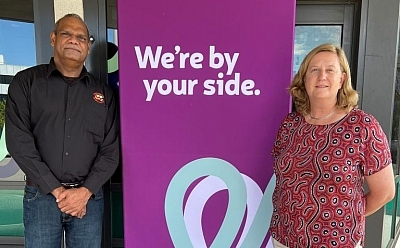 MG Corporation Executive Chair Lawford Benning and St Bart's CEO Samantha Drury stand by a St Bart's sign that reads: