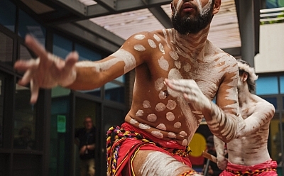 Two men from Binar Futures perform a traditional dance.