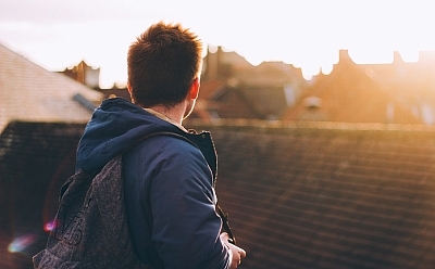 Man looking across homes.